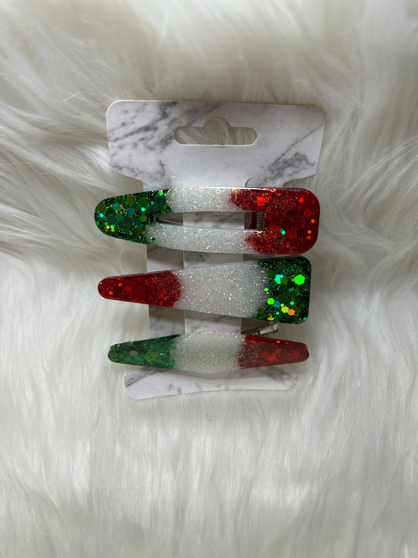 Red, green, and white barrettes