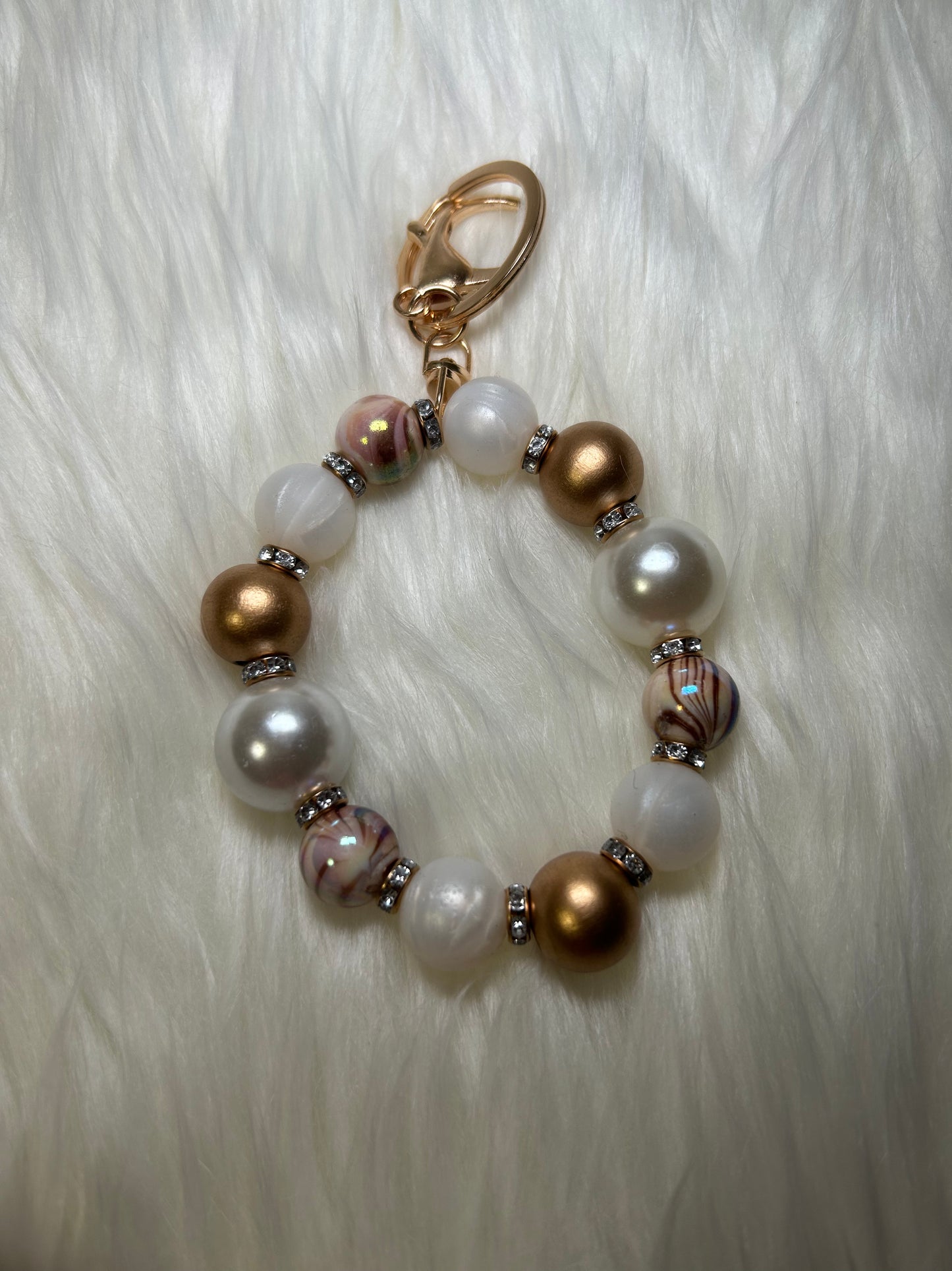 Gold and white wristlet keychain