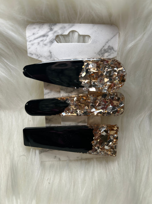Black and gold barrettes