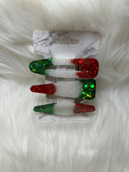 Red, green, and white barrettes
