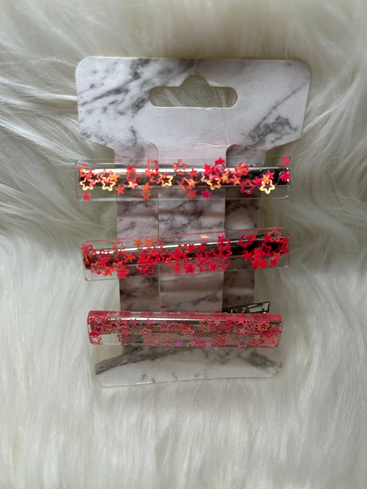 Orange star barrettes