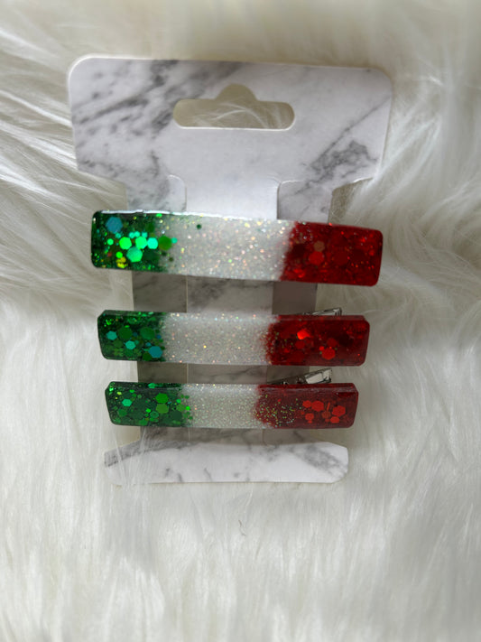 Red, green, and white barrettes