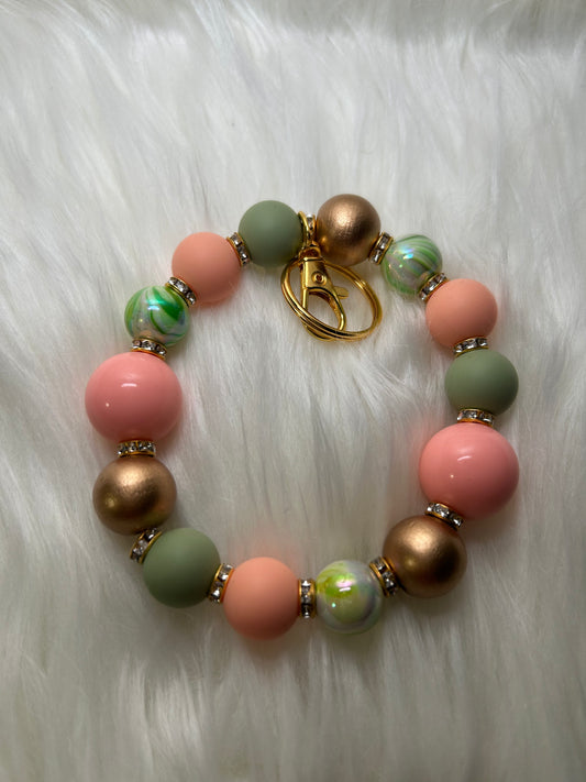 Olive green and peach wristlet