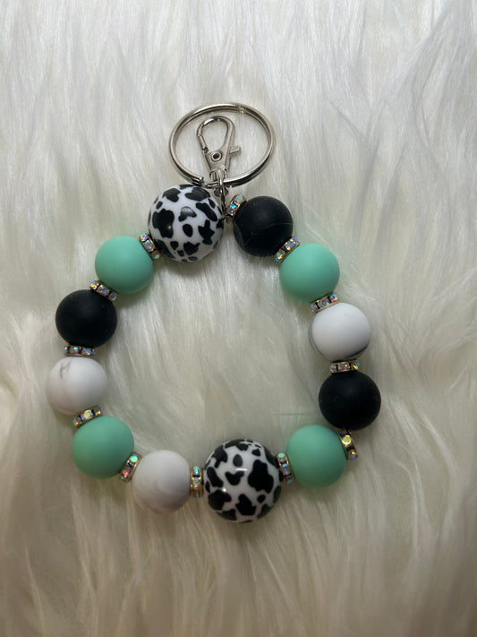 Mint green, black, and white wristlet keychain