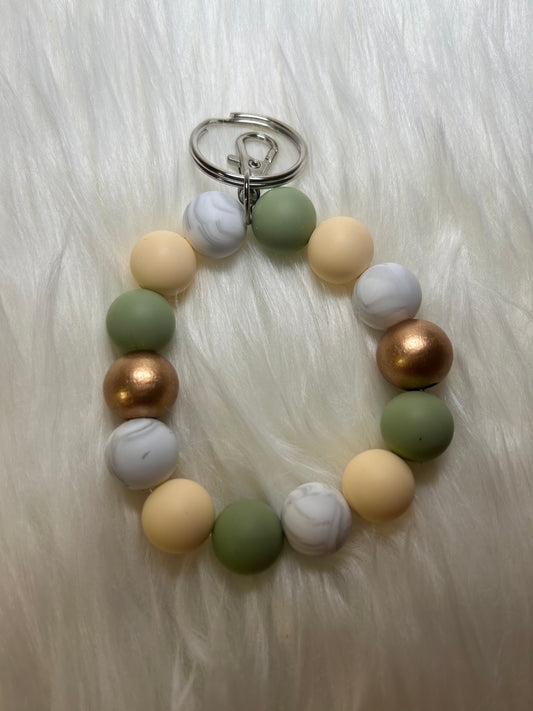 Mint green, cream, and gold wristlet keychain