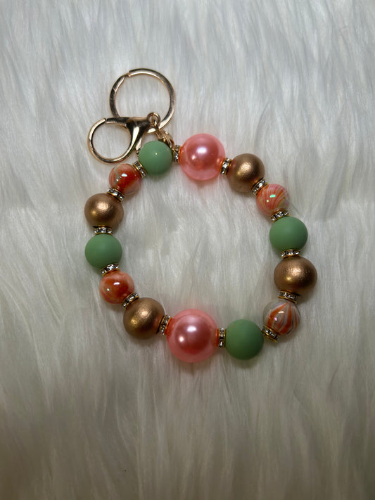Peach, mint green, and gold Wristlet Keychain
