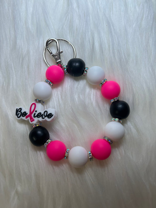 Pink, black, and white breast cancer wristlet keychain
