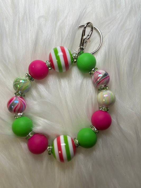Pink, green, and white wristlet keychain