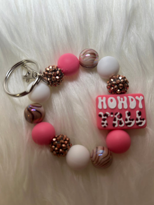 Pink, white, and brown wristlet keychain