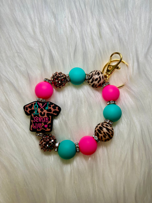 Teal, pink, brown leopard nursing wristlet keychain