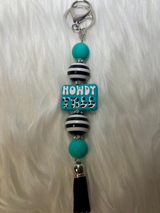 Teal, black, and white keychain