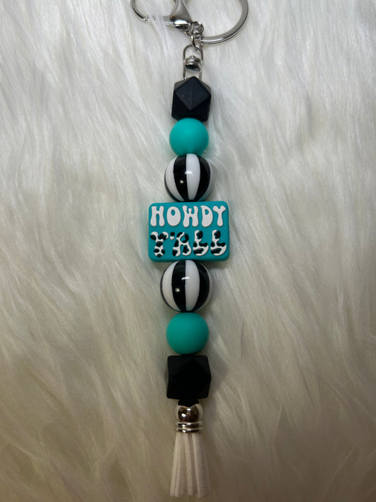 Teal, black, and white keychain