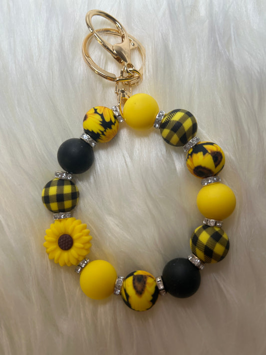 Yellow, black, white sunflower wristlet keychain