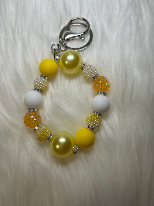 Yellow and white wristlet keychain
